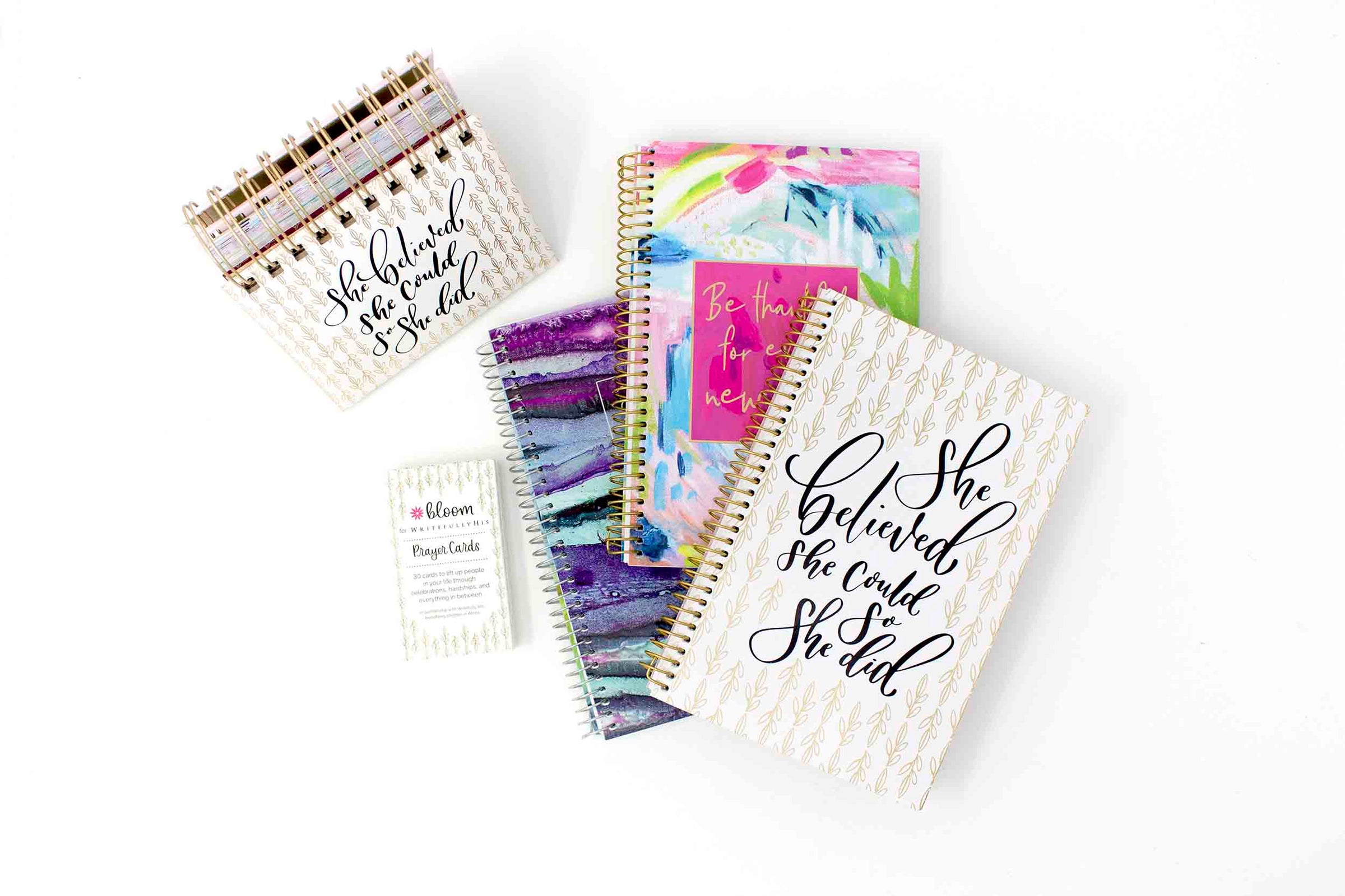 Planners, desk calendar, and prayer cards on a desk