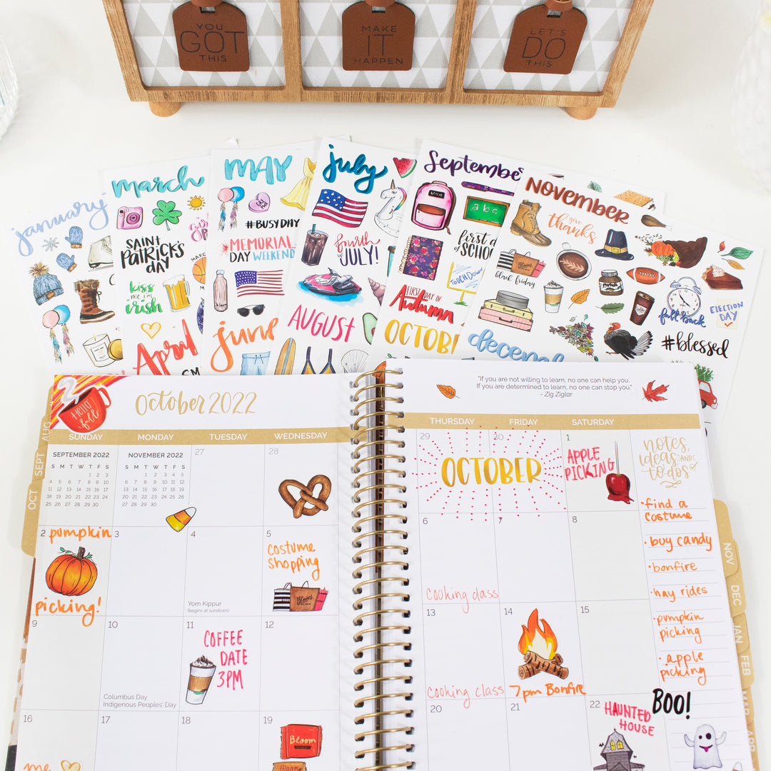 Vintage holiday planner stickers with hand-drawn designs, showcased in a monthly planner for seasonal organization.