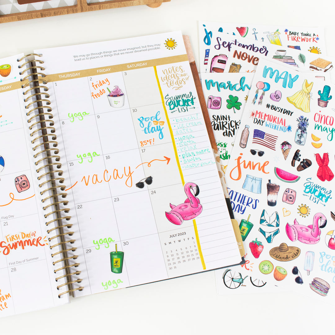 Hand-drawn vintage holiday planner stickers displayed alongside a monthly planner for seasonal planning.