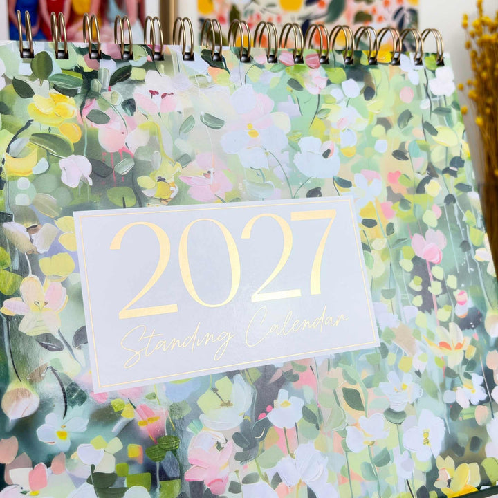 Close-up of gold foil 2027 typography on the bloom Standing Desk Calendar cover.