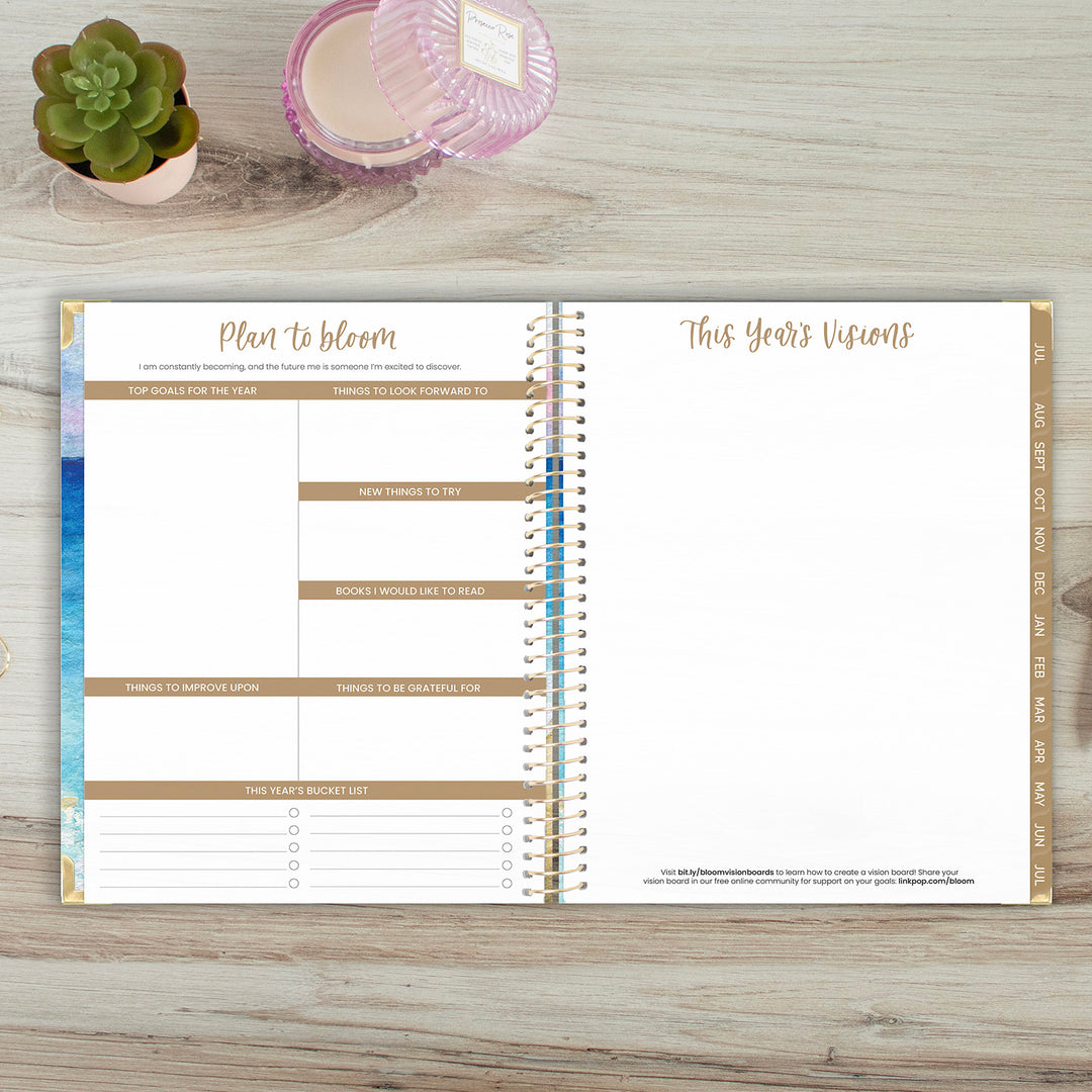 Goal planning page and vision board spread in an open academic year planner spread.