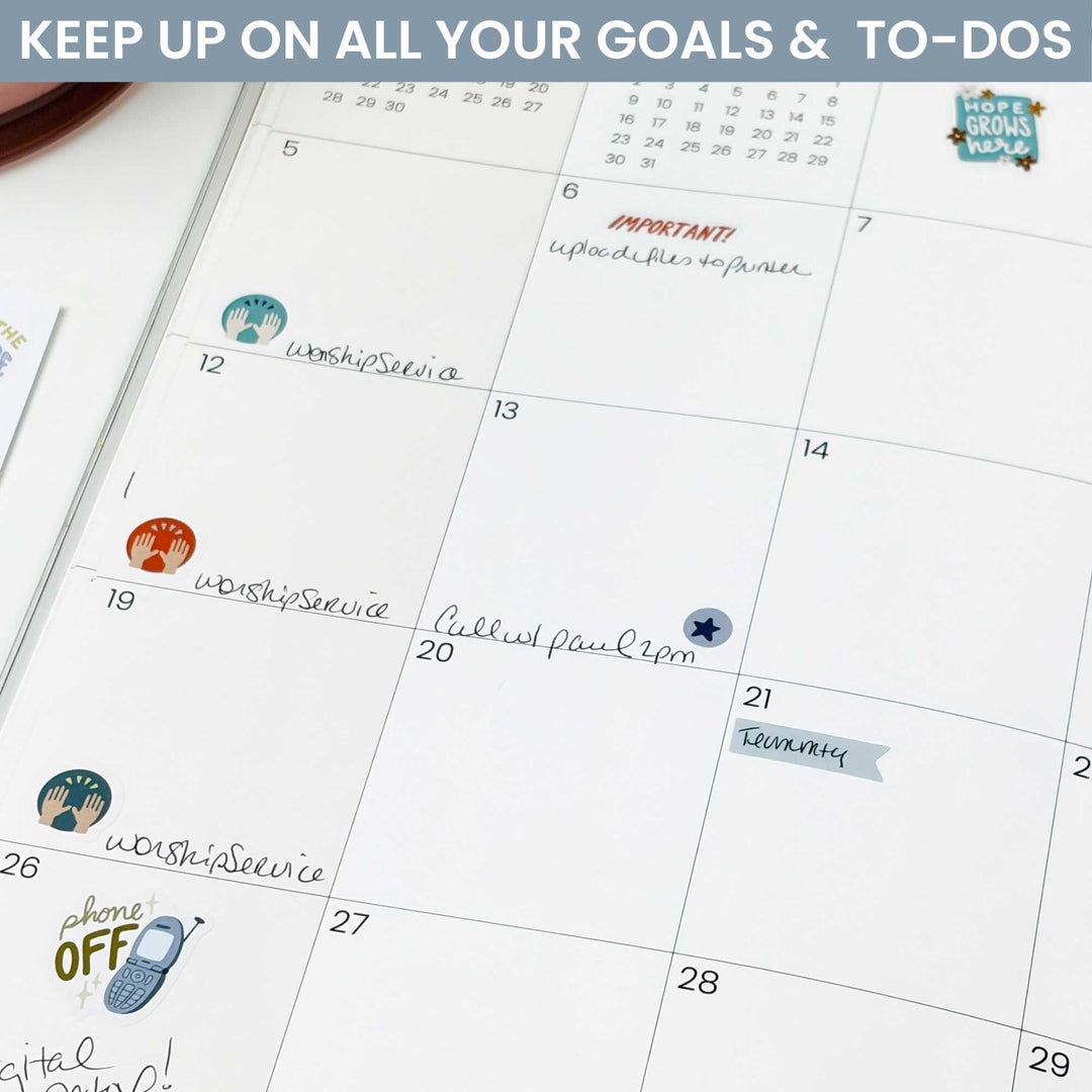 A photo of the stickers being used in the monthly view of a planner. 