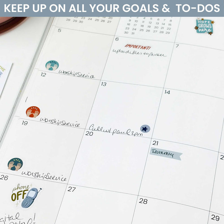 A photo of the stickers being used in the monthly view of a planner. 
