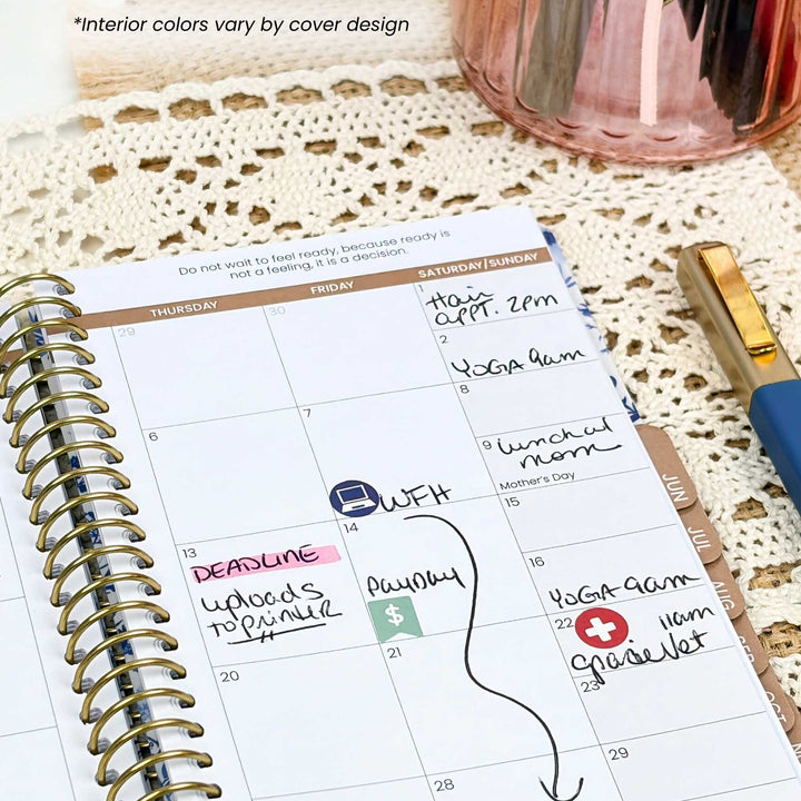 Spiral-bound planner with handwritten notes and events on a textured surface