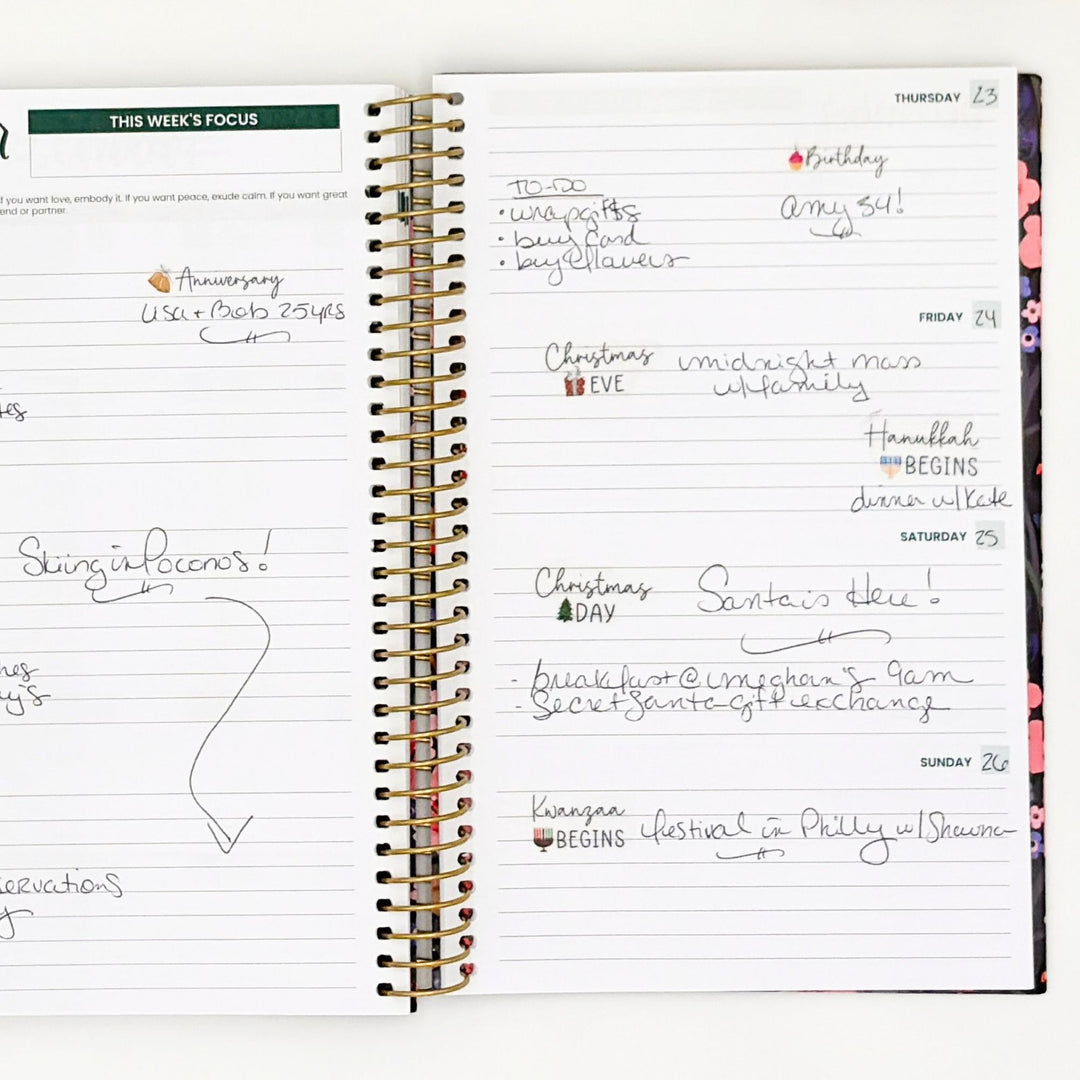 Weekly planner page with holiday celebration notes and sticker accents on headings