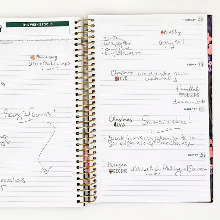 Weekly planner page with holiday celebration notes and sticker accents on headings