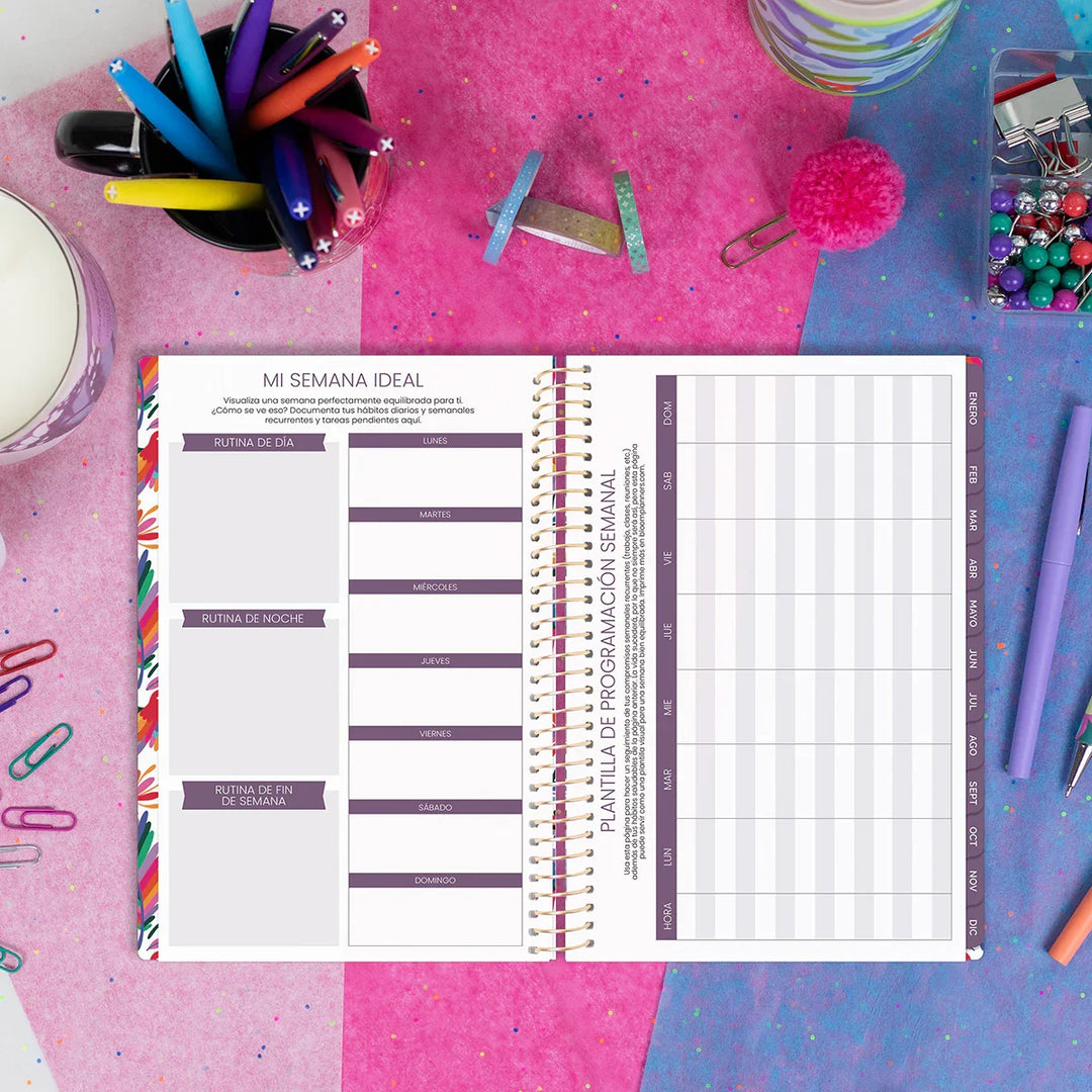 Weekly planner on a colorful desk with stationery items
