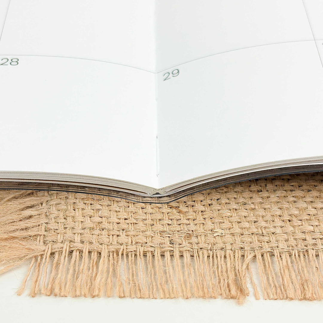 Calendar with jute trim on a white background