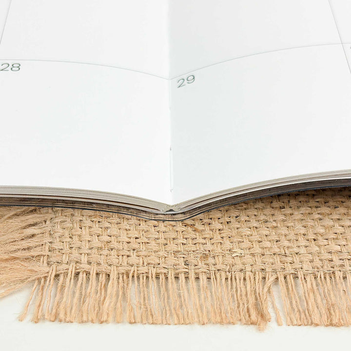 Calendar with jute trim on a white background