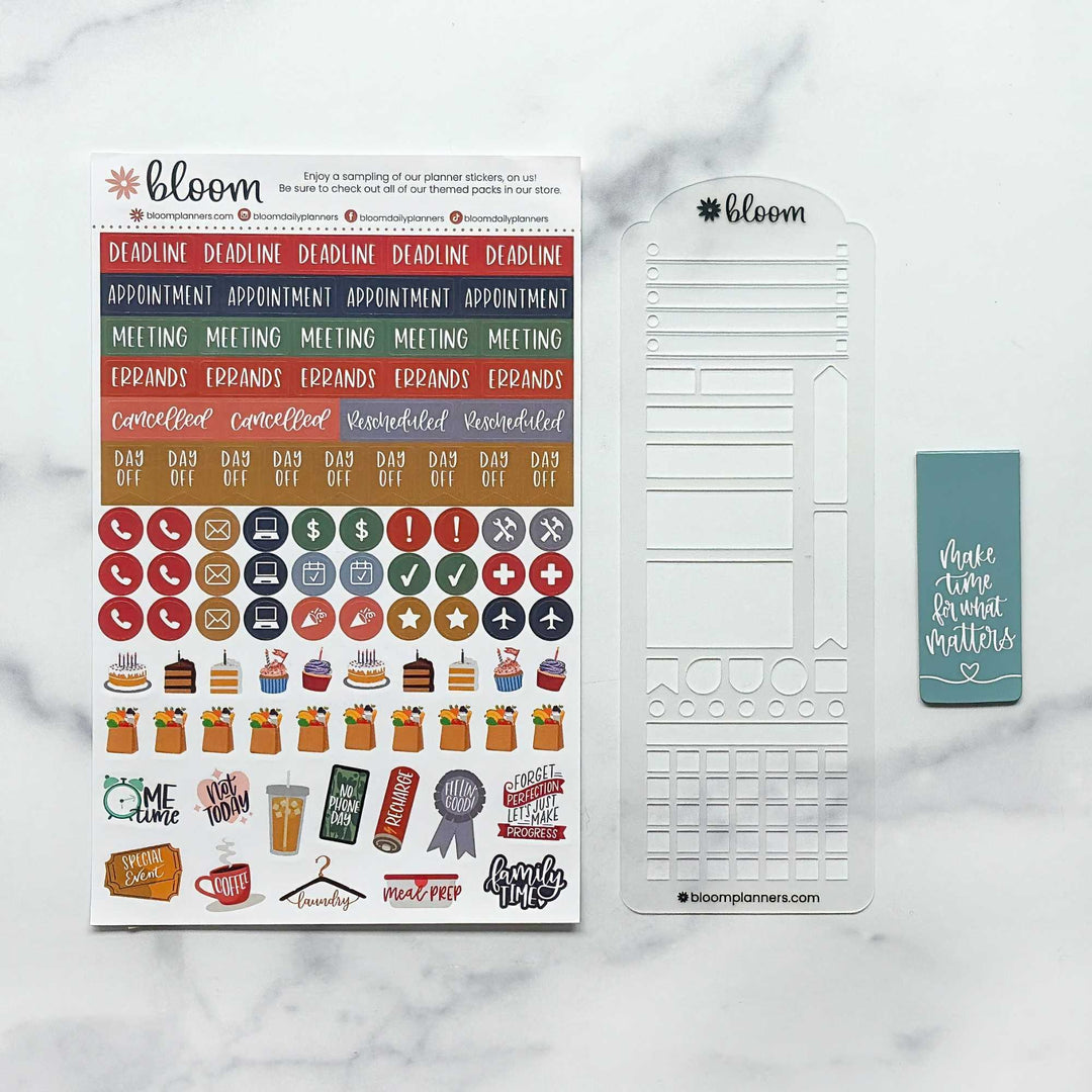 Bloom planner sticker kit and matching planner template set on a white marble background. The set includes a sheet of colorful planner stickers, a white plastic grid template, and a small teal sticky note.