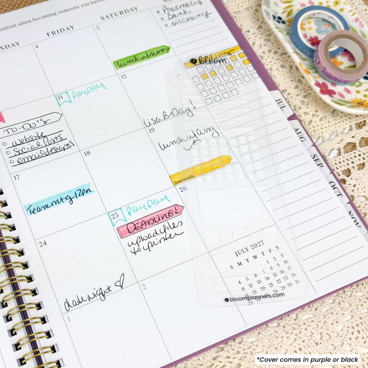 A weekly planner spread from a Blooming Paper Planner, showing a printed calendar page with handwritten notes, colored highlighters, and a small section of a purple cover. A decorative lace cloth and floral washi tape are visible in the background.