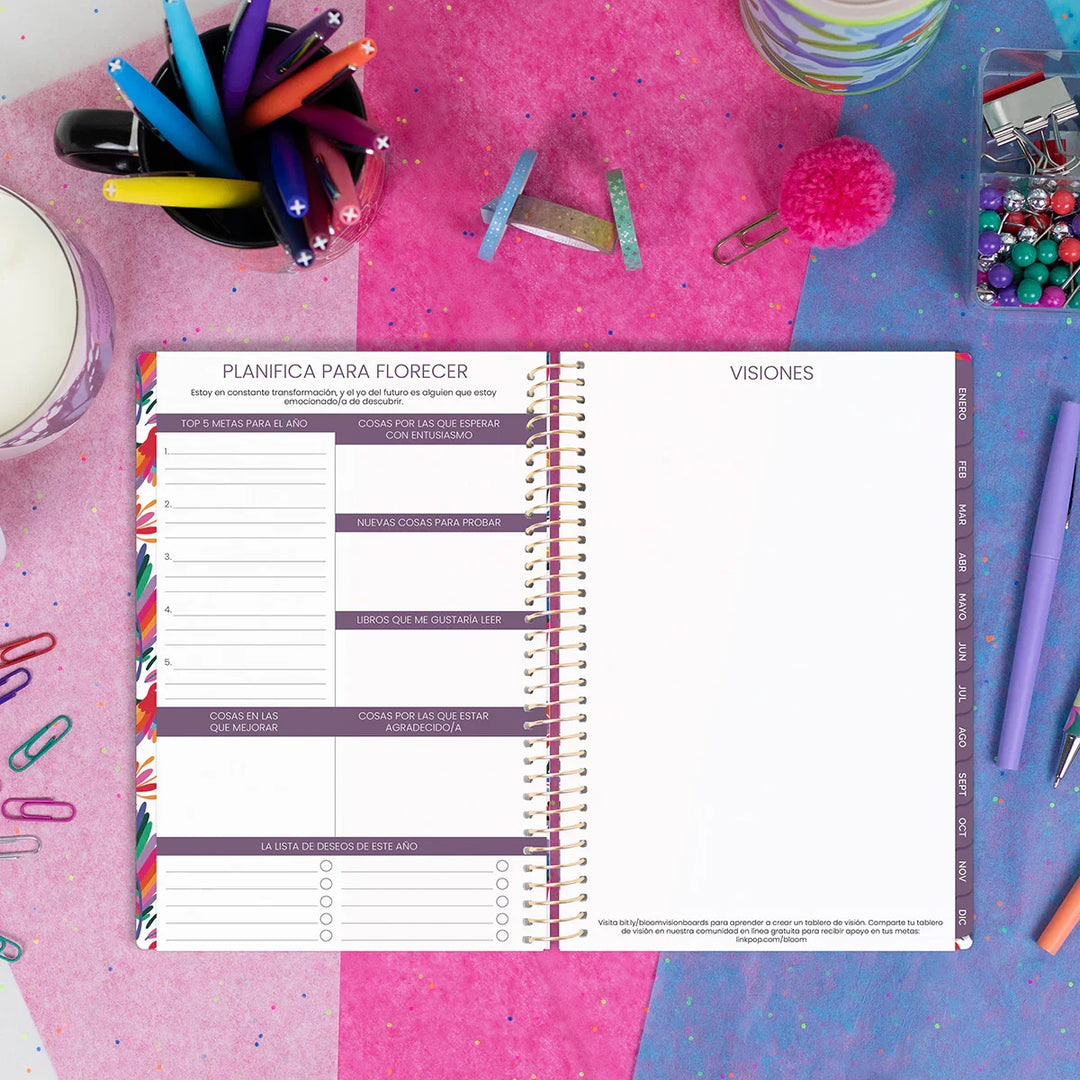Planner with a colorful design on a desk with stationery items