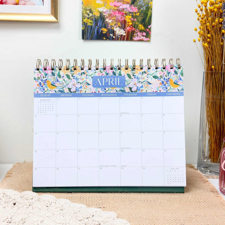 April view of the standing flip calendar on a styled desk. 