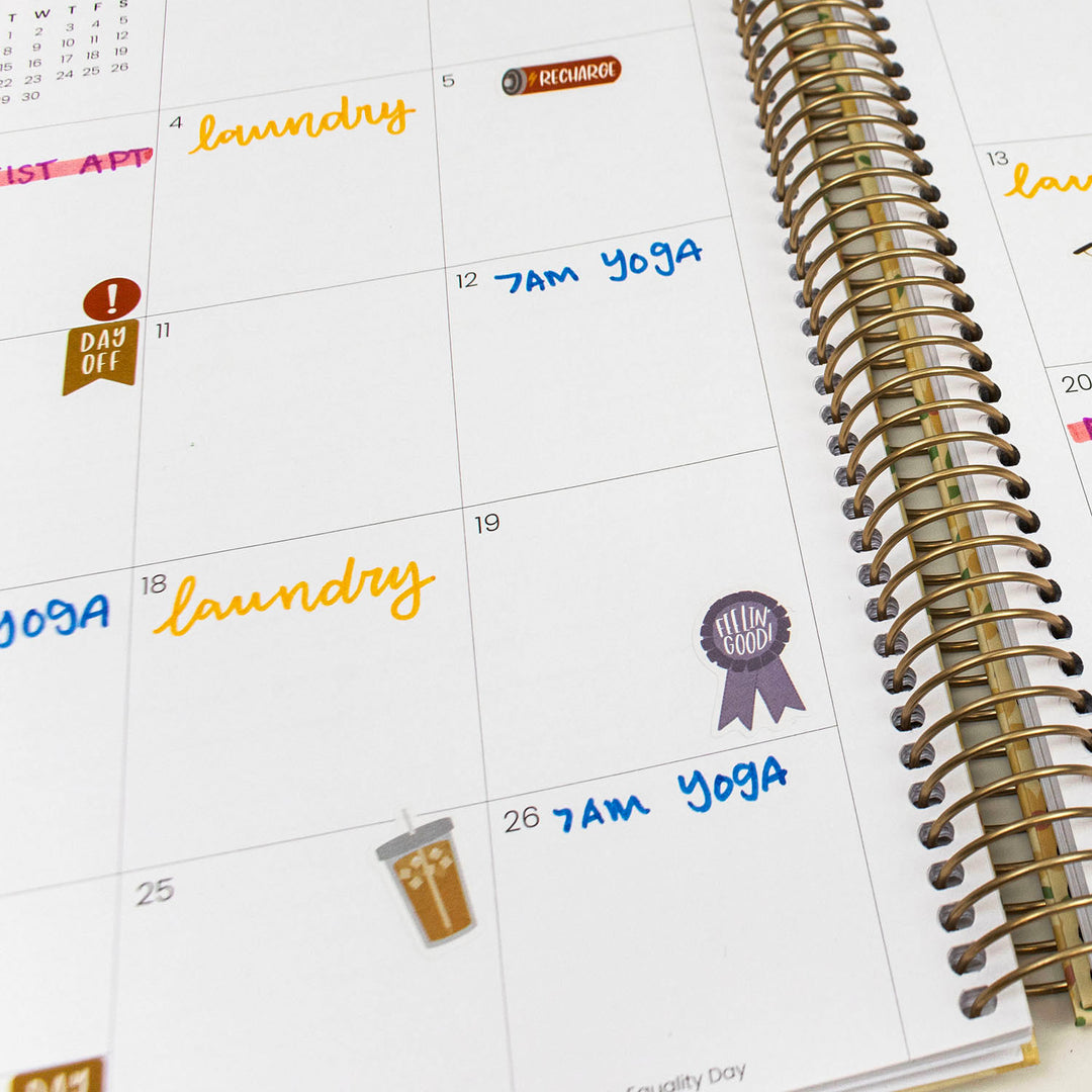 Calendar with stickers on a white surface