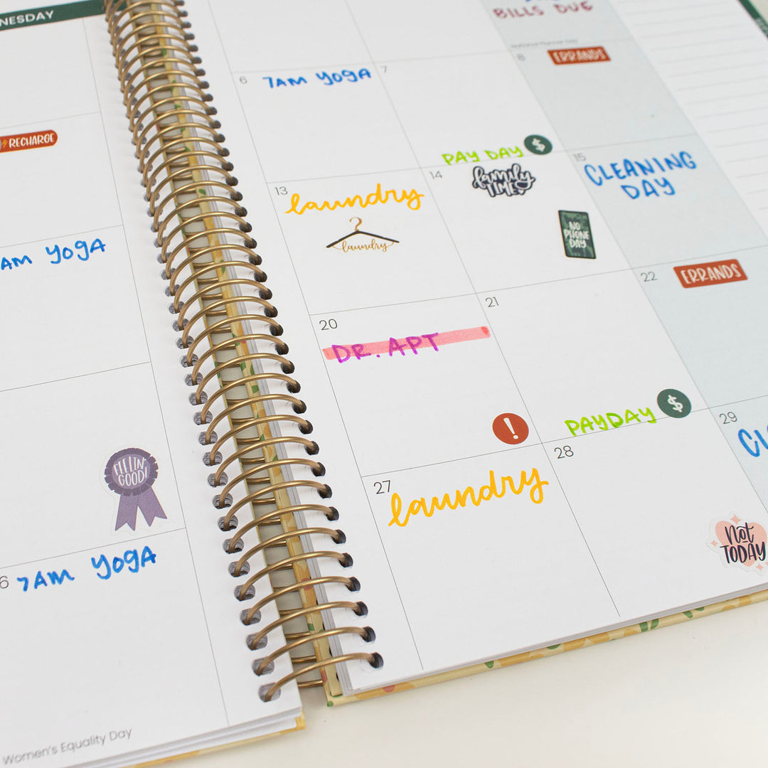 Calendar with stickers on a white surface