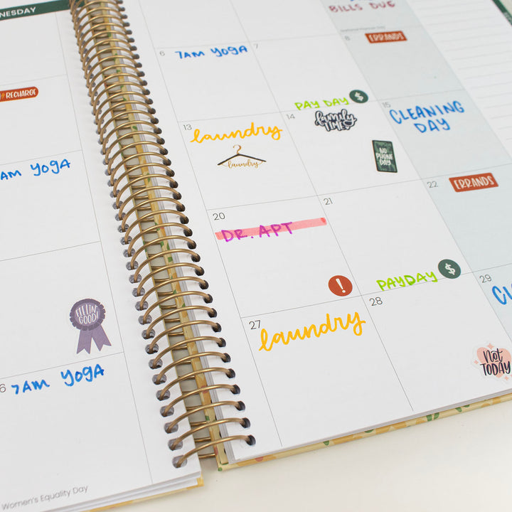 Calendar with stickers on a white surface