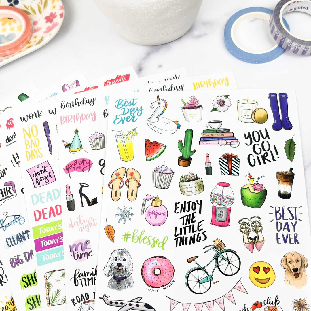 Collection of colorful everyday stickers on a white background with a mug and tape in the corner.