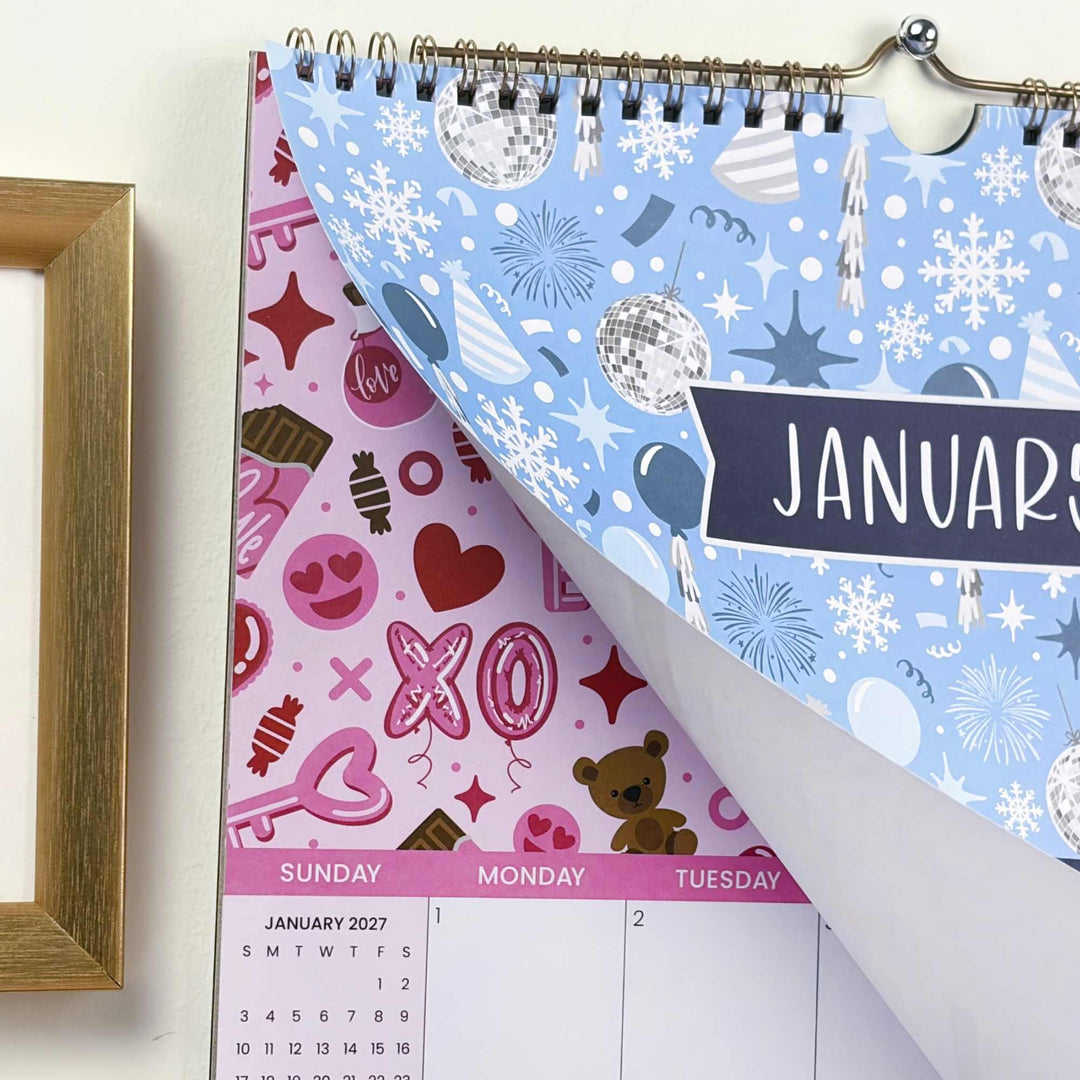 Calendar with January design, featuring snowflakes and Christmas elements, on a white surface.