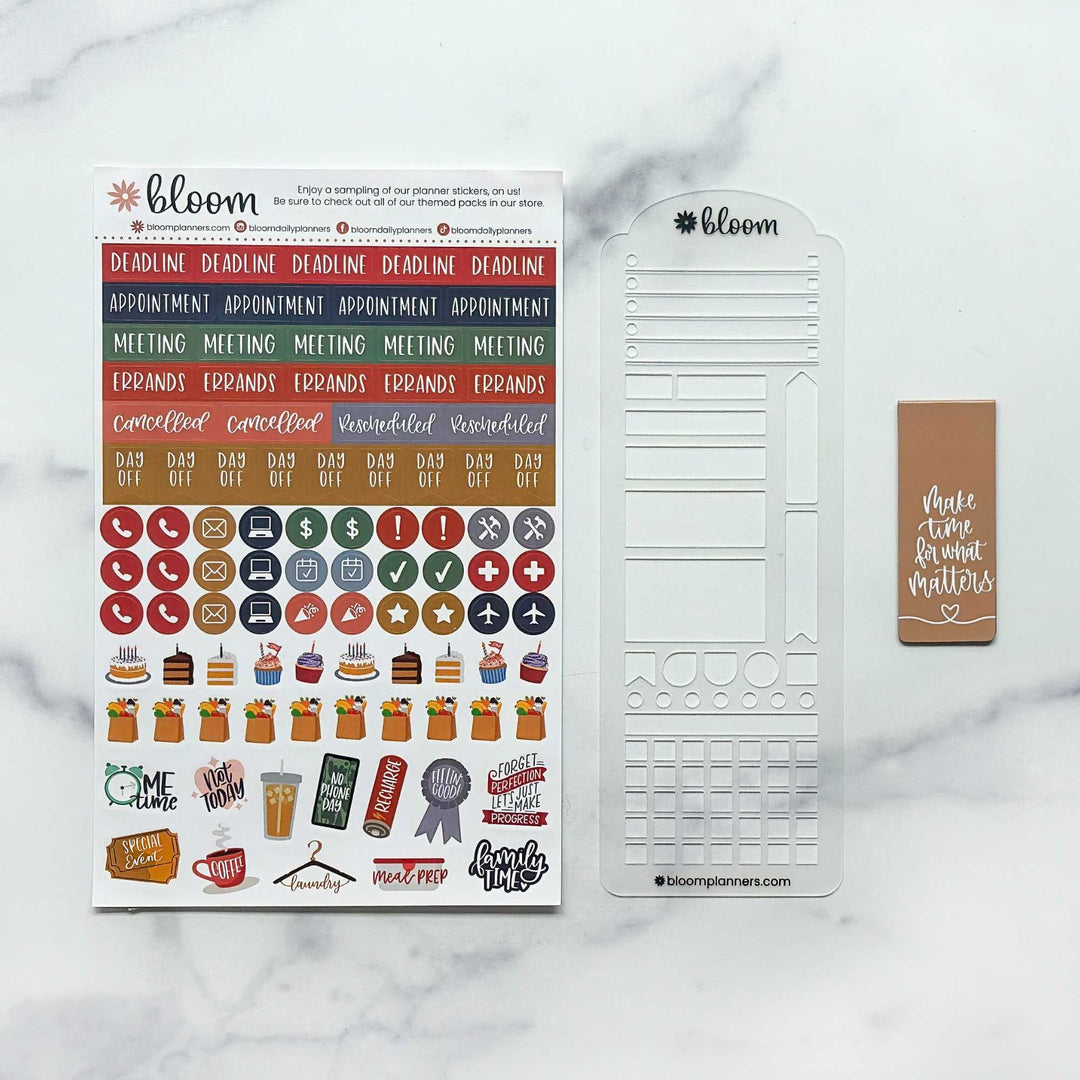 A planner sticker set and template kit from bloom planner markers, featuring a colorful sticker sheet with coffee-themed icons and labels, a clear plastic layout template, and a brown sticky note on a white marble background.