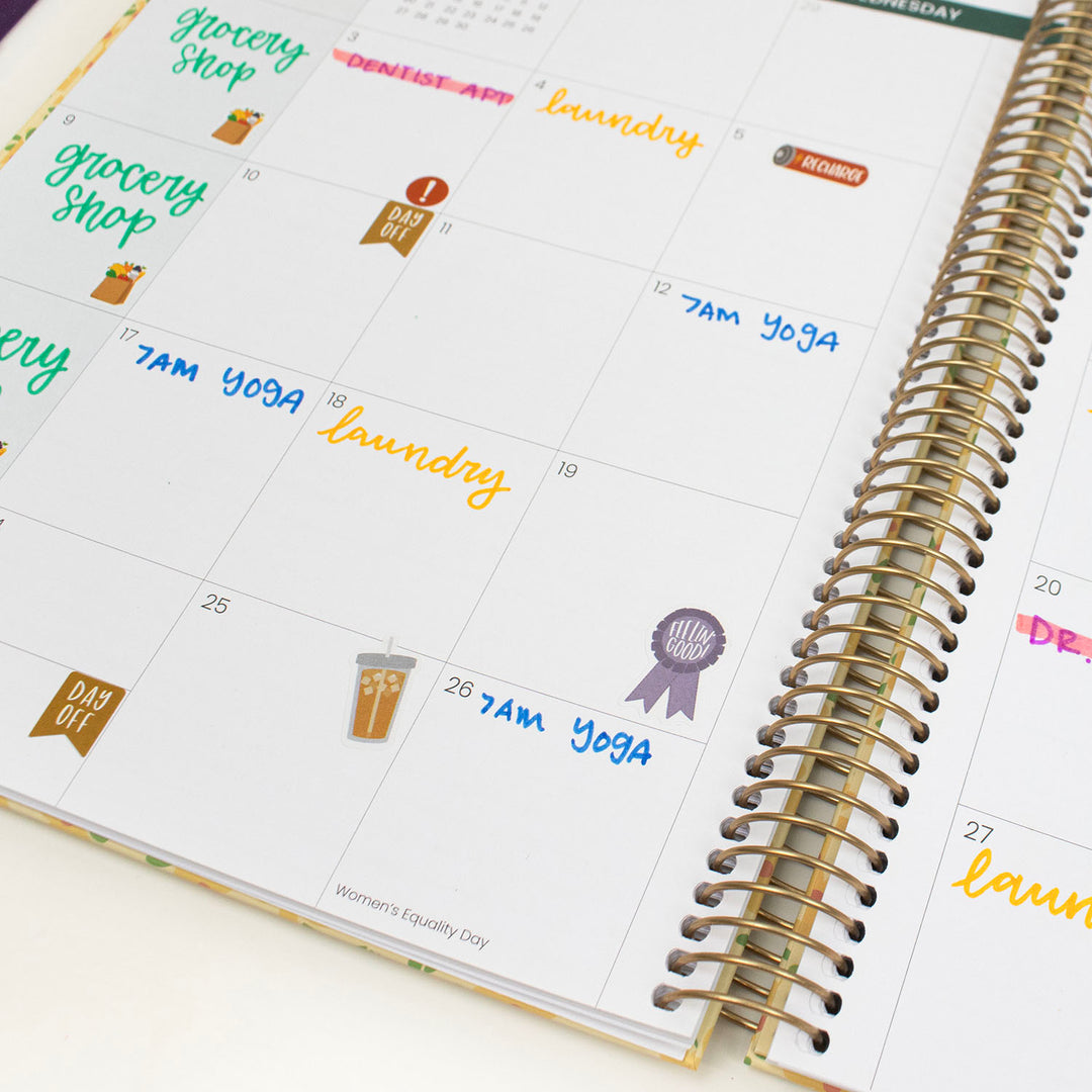 Calendar planner with stickers on a white surface