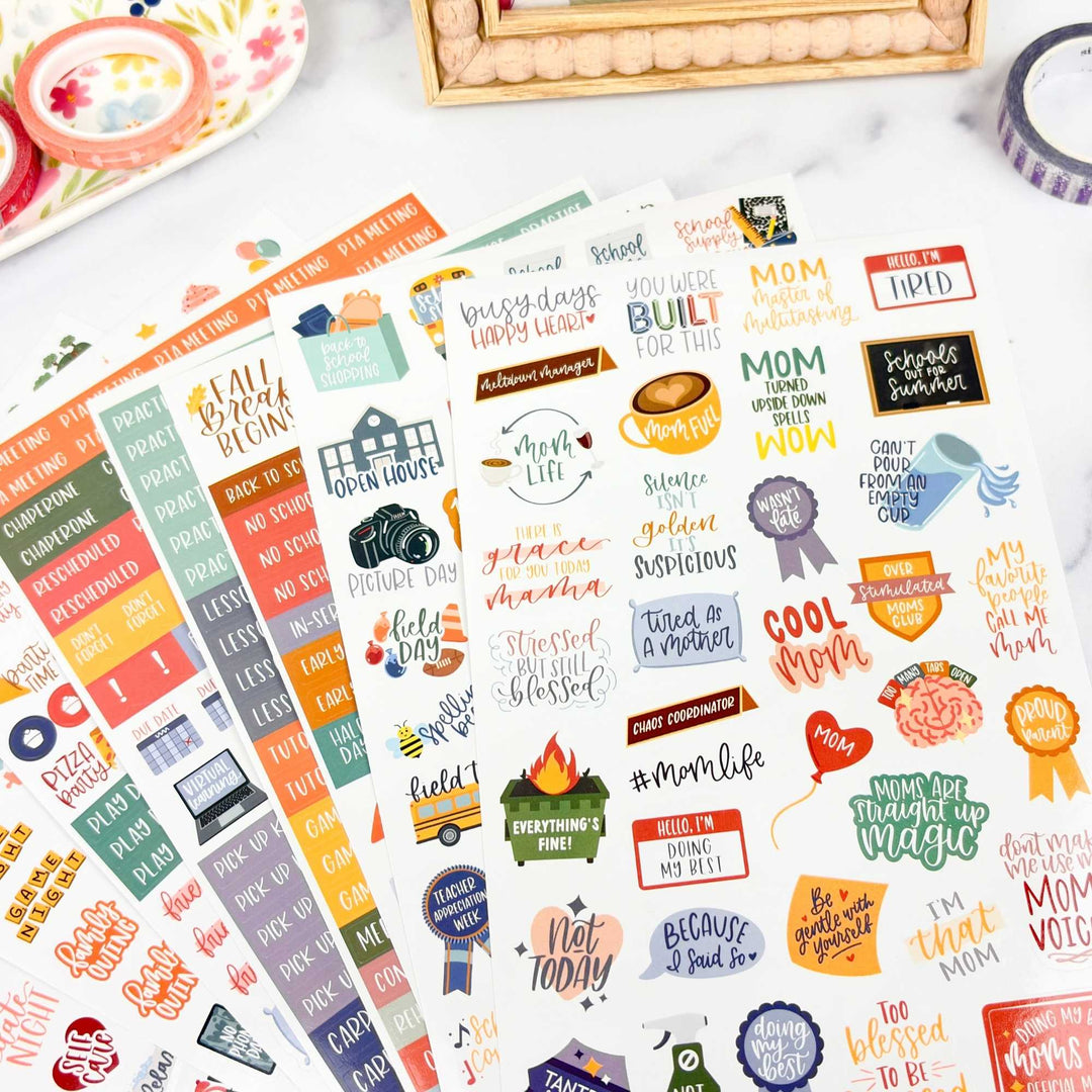 Collection of colorful mom themed planner stickers with various designs and text on a white surface.