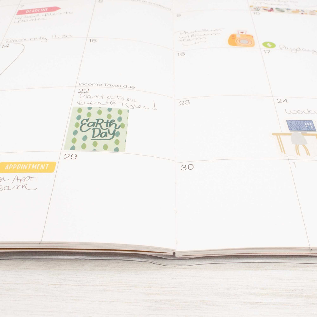 Calendar with stickers on a white surface