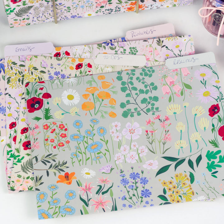 Floral patterned file folders on a white surface