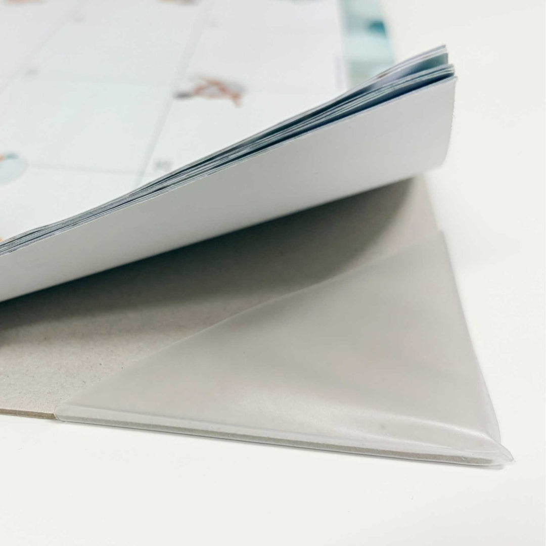 Close-up of a stack of white papers on a light gray background