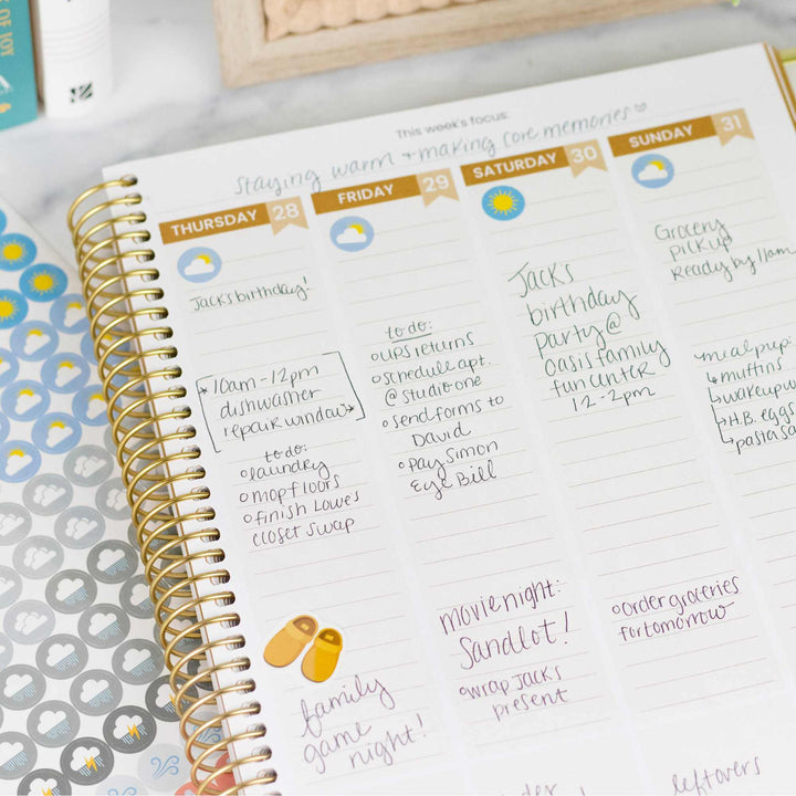 Weekly planner with handwritten notes and tasks on a desk
