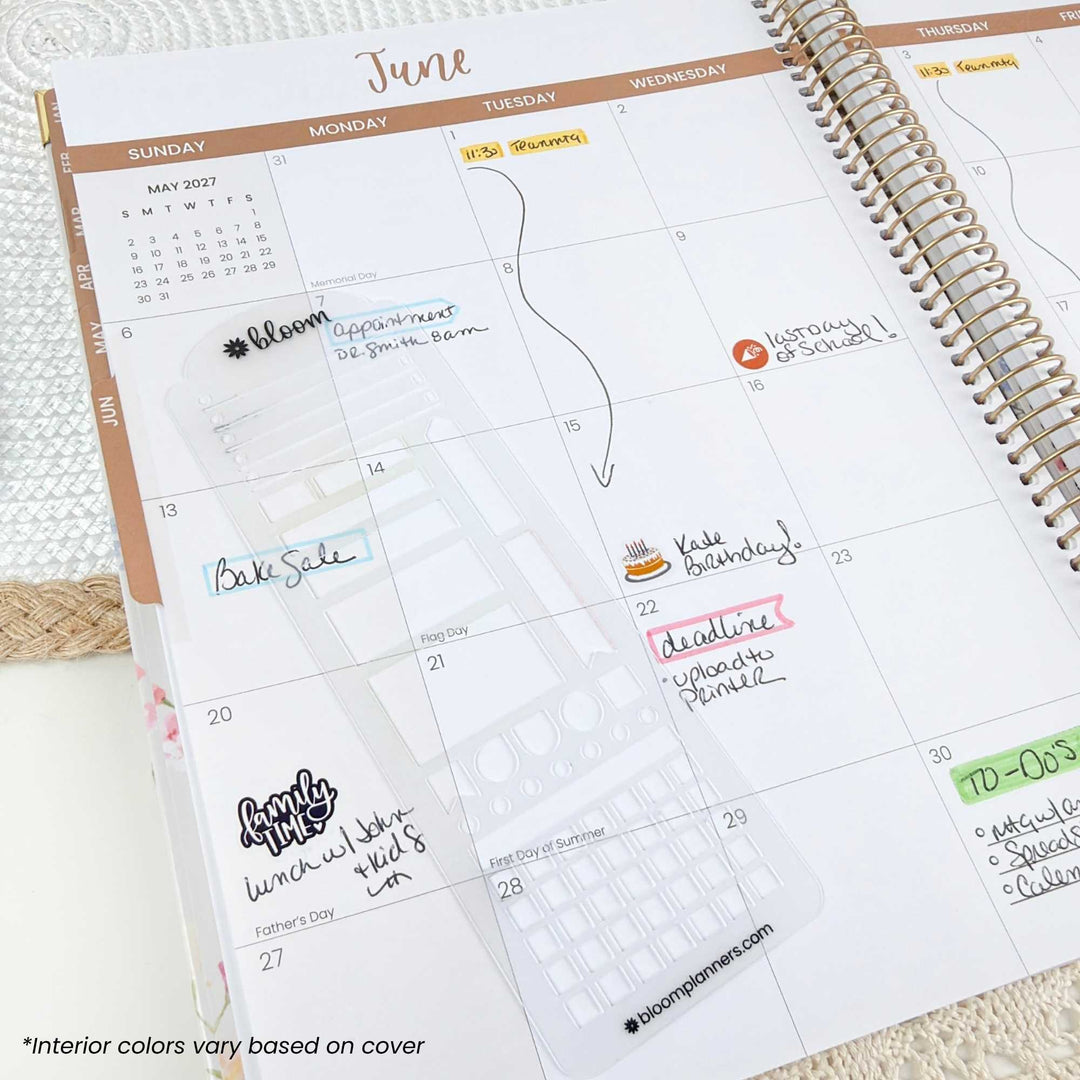 A spiral-bound planner open to a June calendar page, showing a floral planner insert and handwritten notes in pastel colors. The brand name 'blossomplaners' is visible at the bottom of the page.