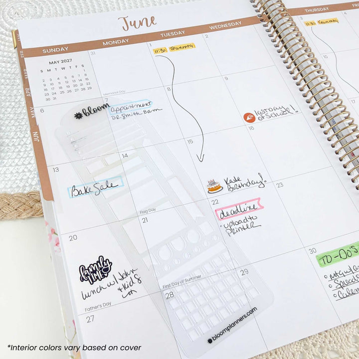 A spiral-bound planner open to a June calendar page, showing a floral planner insert and handwritten notes in pastel colors. The brand name 'blossomplaners' is visible at the bottom of the page.