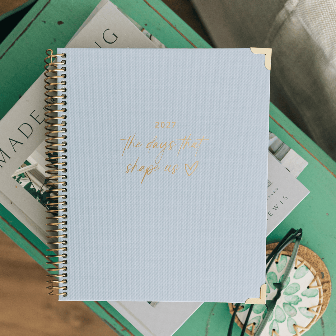 Christian planner cover with gold '2027 the days that shape us' title