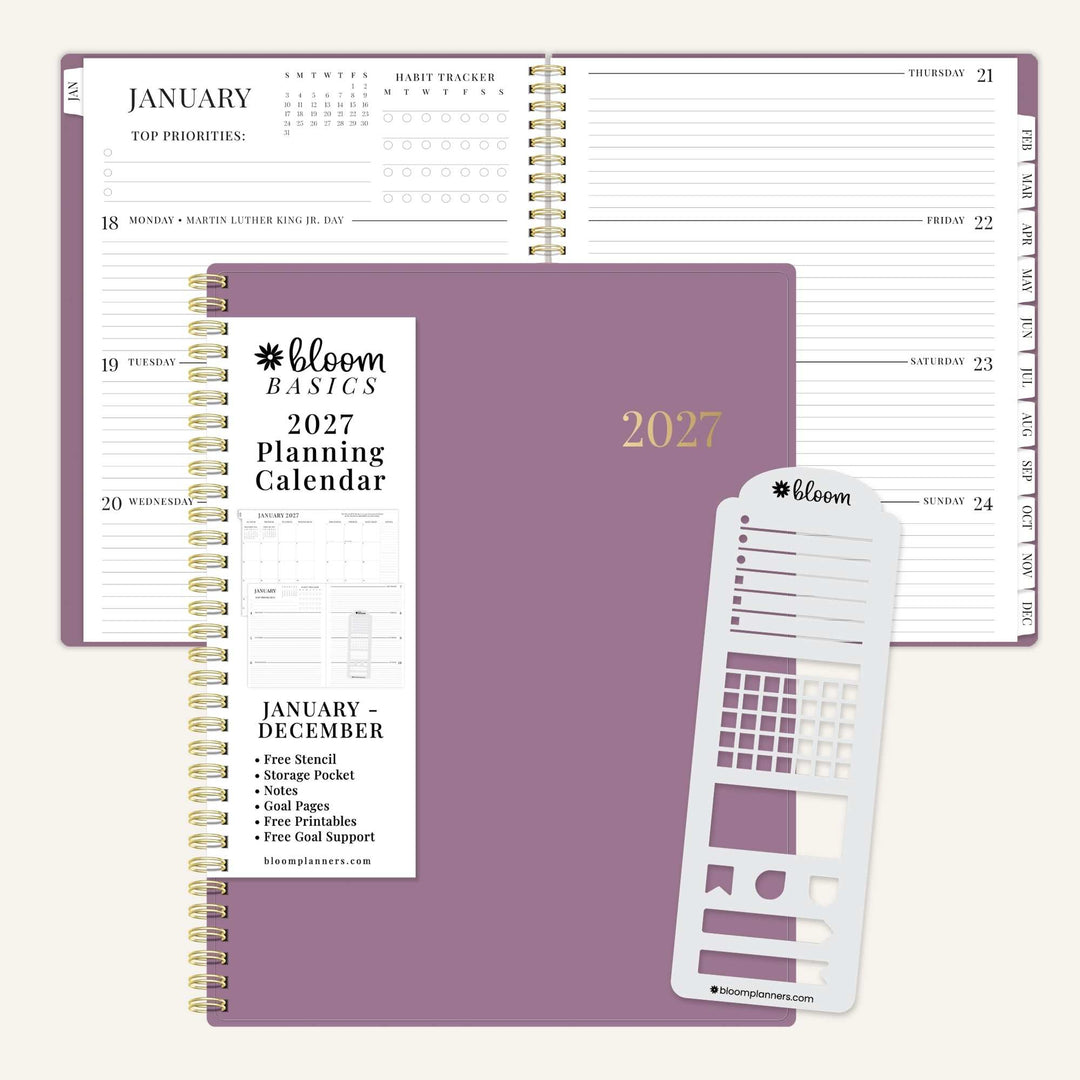 Bloom Basics 2027 Spiral Planning Calendar shown open with its purple cover, included planner inserts, and a white notepad on a light beige background.