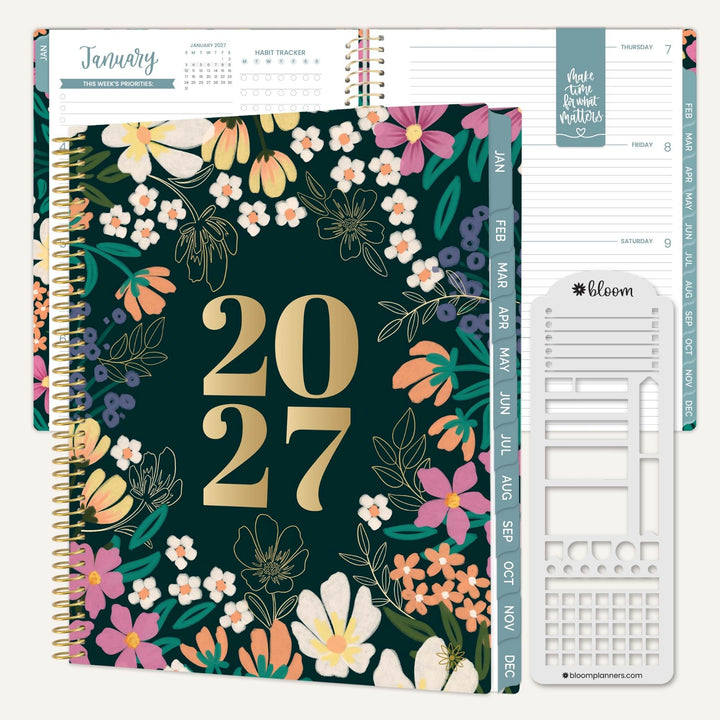 A 2027 spiral-bound planner shown open with floral cover pages and a white insert page, on a light neutral background.