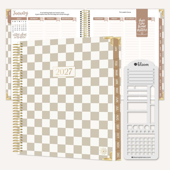A spiral-bound 2027 planner shown open with interior pages and a white page divider set on a light beige background. The planner cover has a beige and white checkerboard pattern with gold accents and the year 2027 centered on the front.