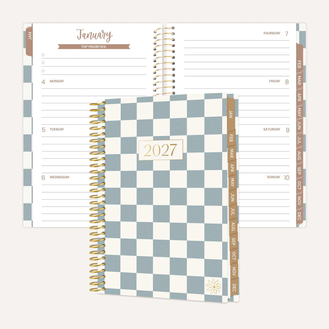 An open and closed view of a 2027 spiral-bound planner. The closed cover features a blue and white checkerboard pattern with a gold foil '2027' label.