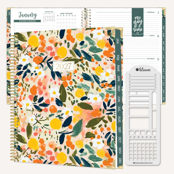 A spiral-bound 2027 planner shown open with floral interior pages and a separate white plastic insert sheet, photographed on a clean white background.