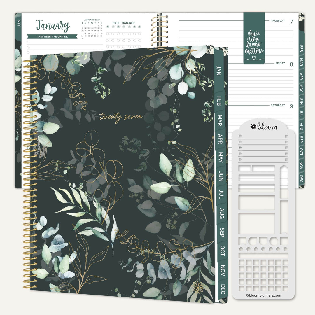 A spiral-bound planner set shown on a light neutral background. The main product is a dark green floral planner with eucalyptus and gold leaf illustrations, alongside open interior pages and a white plastic insert tool branded bloom.