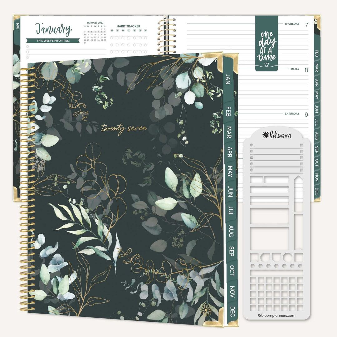 A spiral-bound planner shown open with floral cover pages and interior weekly layout inserts. The cover features a dark green background with white and pale green eucalyptus leaves and gold botanical line art, plus gold spiral binding and a green vertical date strip.