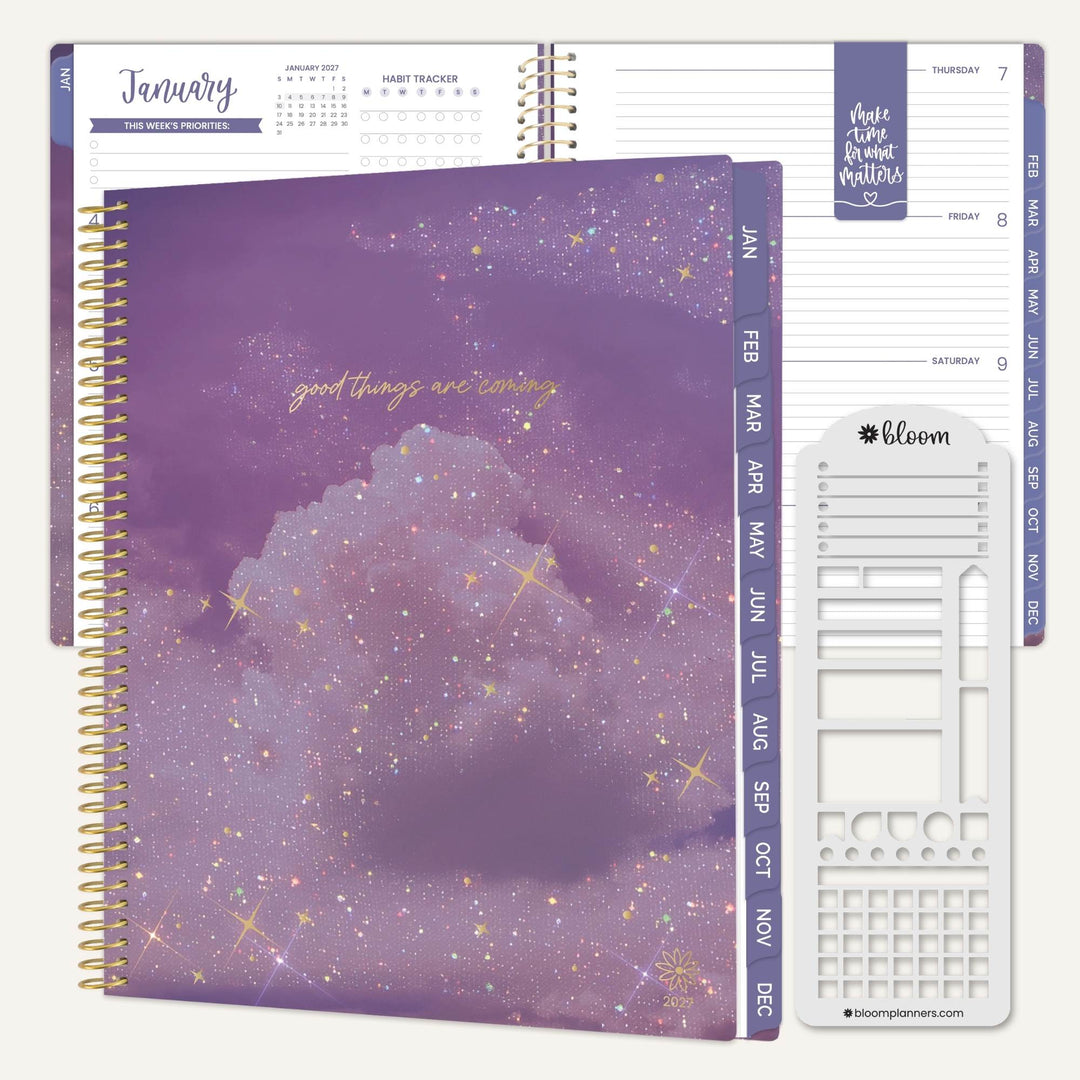 A spiral-bound planner shown open with a large purple glittery cloud cover on the front, plus interior pages and a white sticker sheet labeled bloom planner stickers. The visible text includes 'good things are coming' and 'make time for better matters.