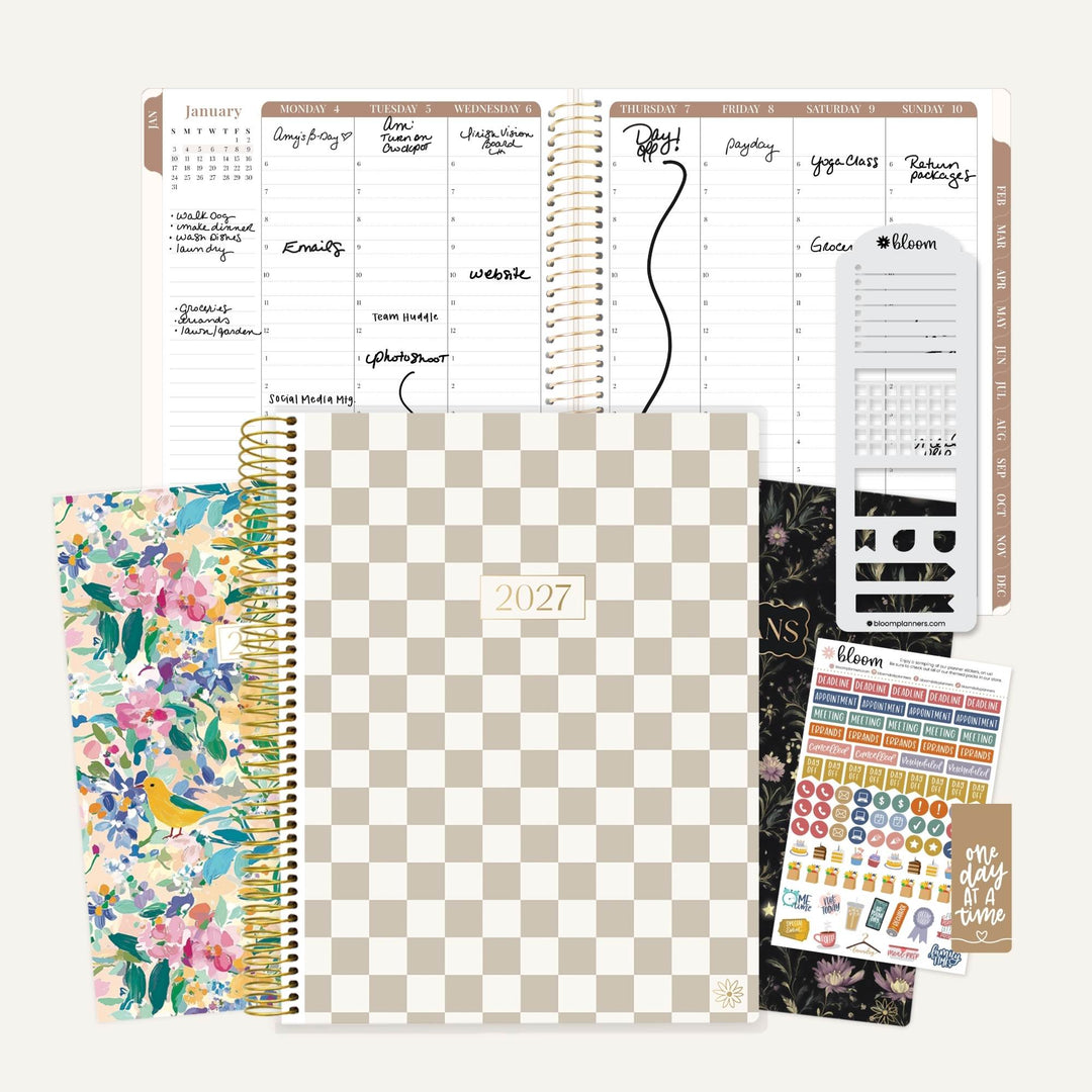 A stationery planner set arranged on a light beige background, including a 2027 spiral-bound planner with a beige-and-white checkerboard cover, a floral planner, sticker sheets, and an open weekly planner page spread.