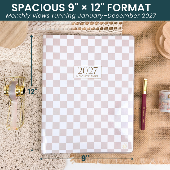 9"  x 12" checkered monthly planner on a desk with arrows showing the size. 