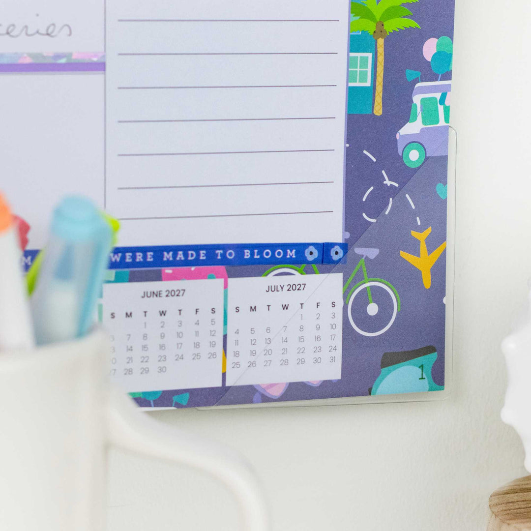 Calendar with travel-themed design on a white surface