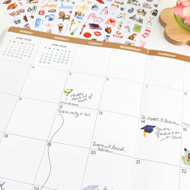 Wide-angle planner view showing May 2026 with sticker sheets above