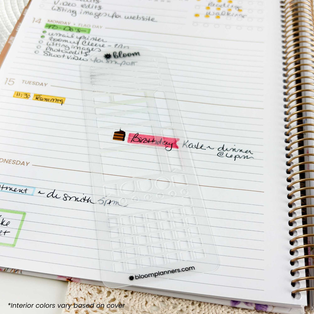 A close-up of a spiral-bound planner page with lined sections, handwritten notes, and a small pink highlighted date entry reading 'Birthday Kater dinner @6pm'.