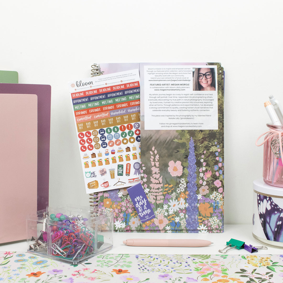 Planner with stickers and stationery on a desk