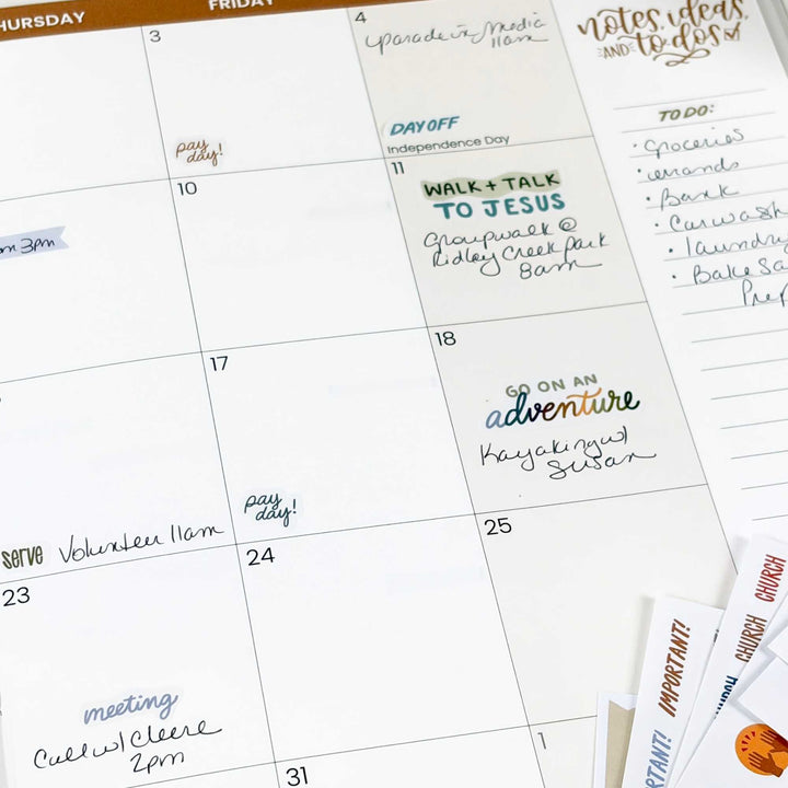 A planner with the sticker "go on an adventure' featured. 