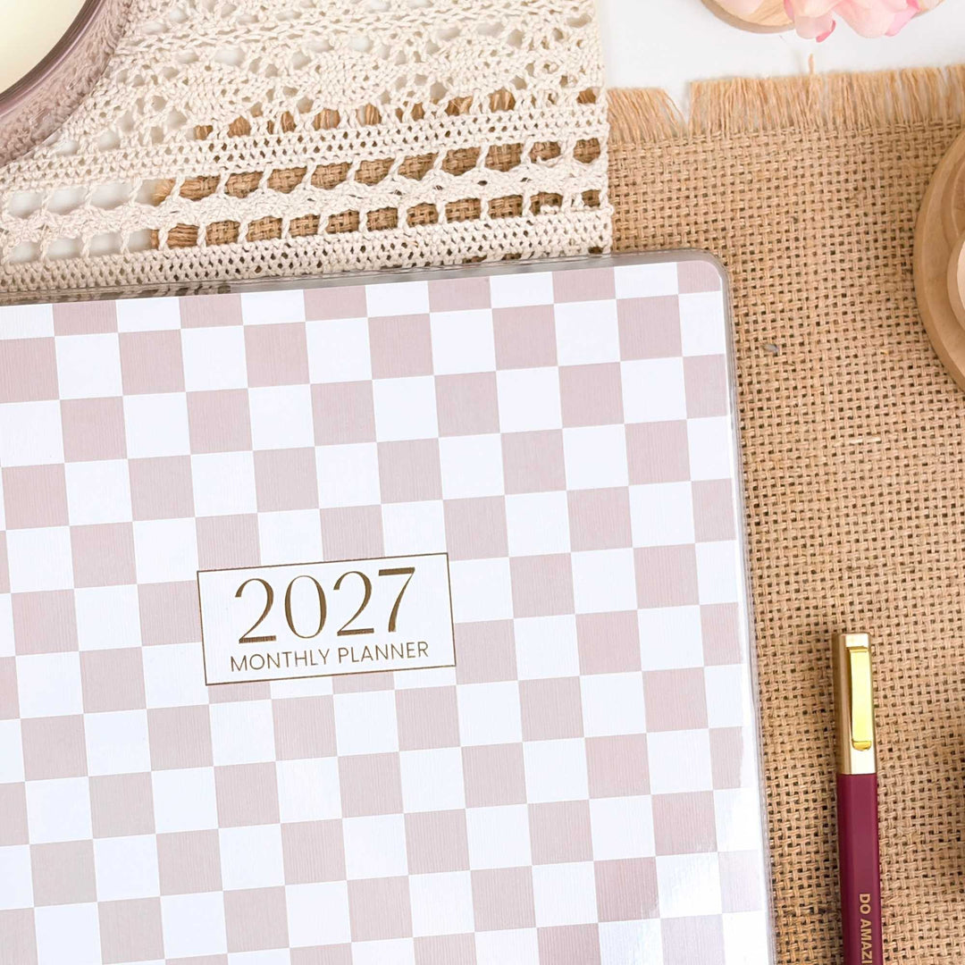 2027 monthly planner with checkered design on a textured surface