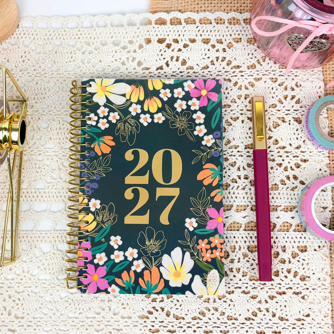 Closed 2027 pocket planner on a desk.