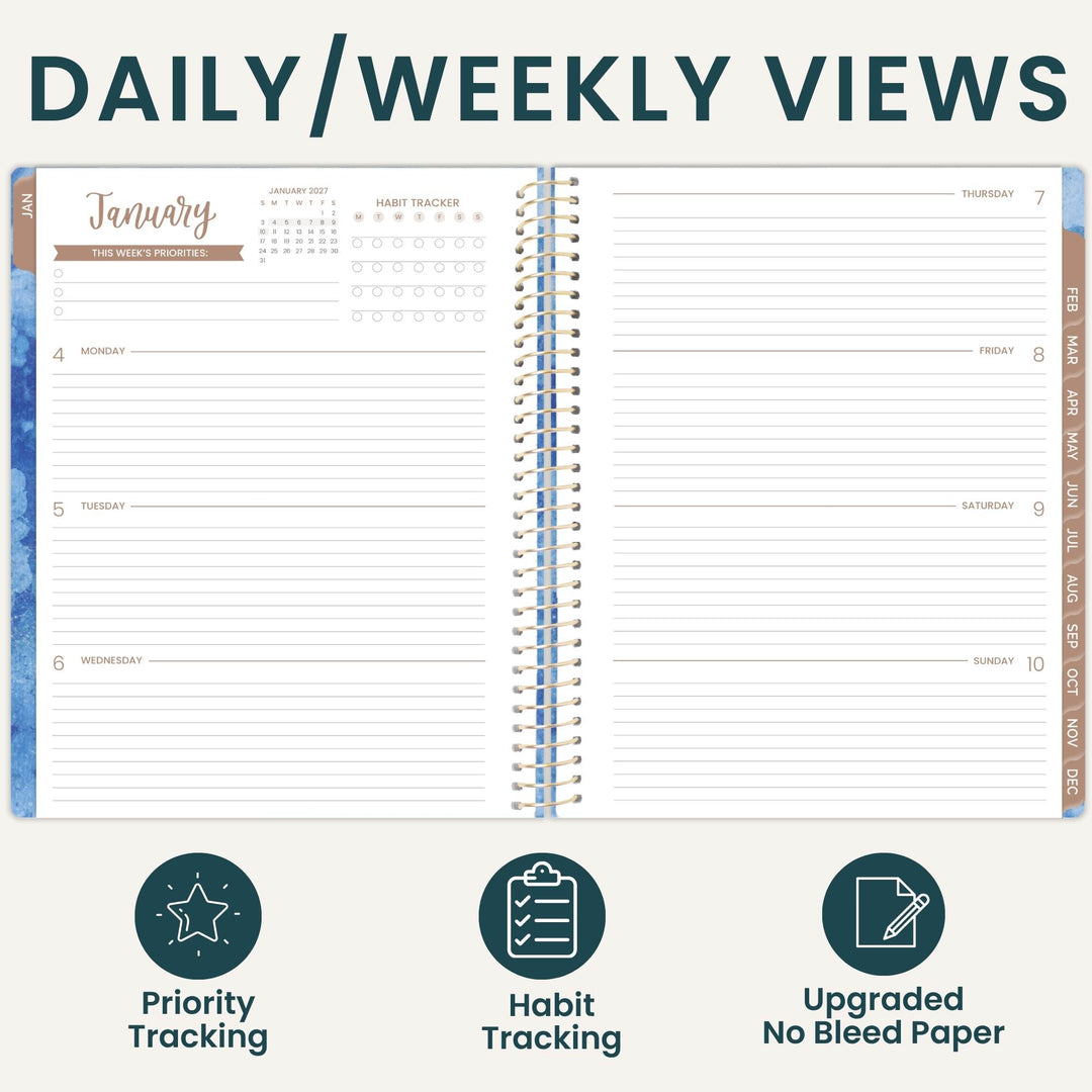 An open spiral-bound planner shown on a light beige background with the heading 'DAILY/WEEKLY VIEWS' at the top and three feature icons below: Priority Tracking, Habit Tracking, and Upgraded No Bleed Paper. The planner pages are mostly white with dark teal text and lines, plus small tan and blue decorative accents.